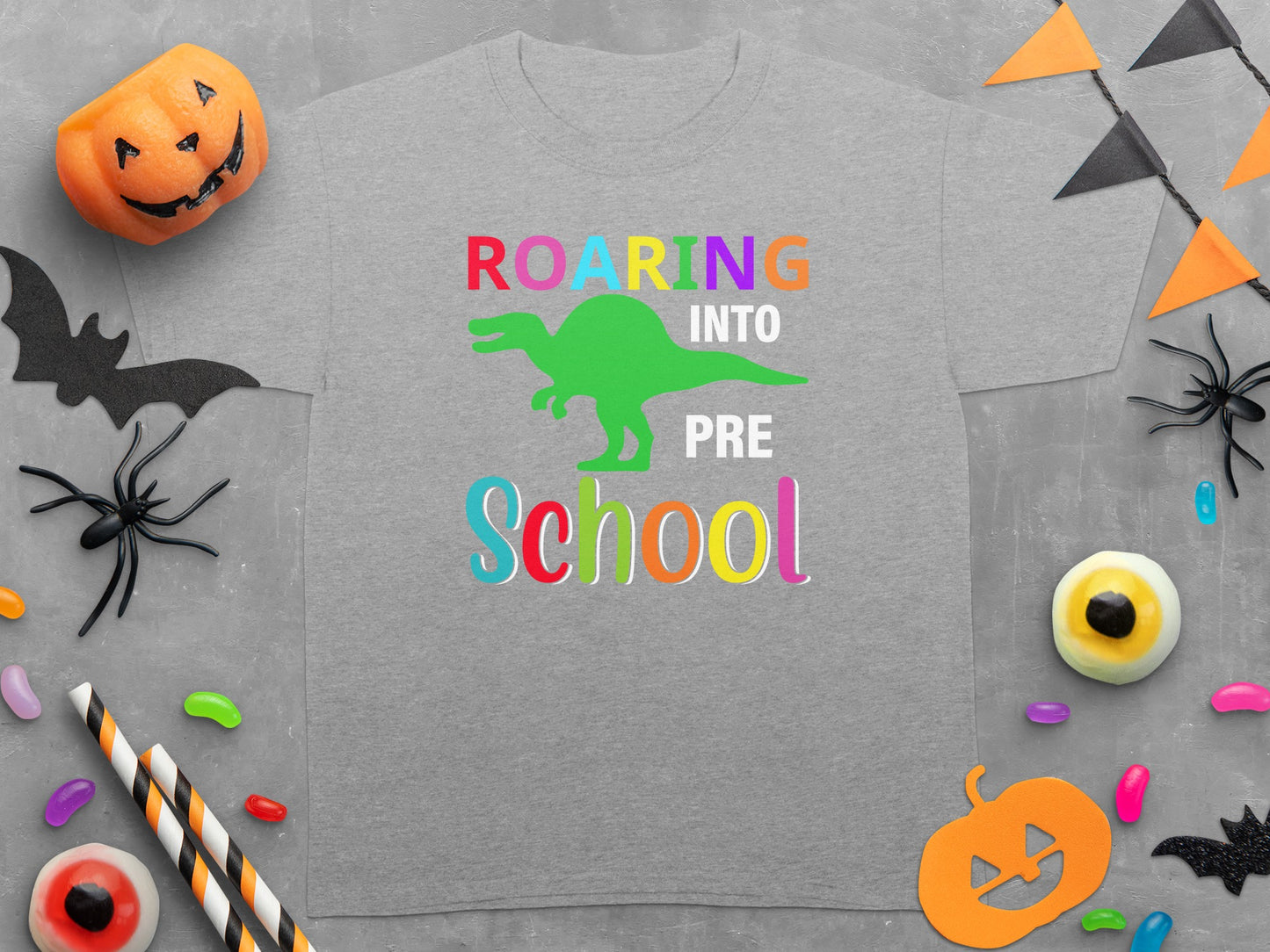 Gray t-shirt with "Roaring Into Pre School" and green dinosaur graphic.