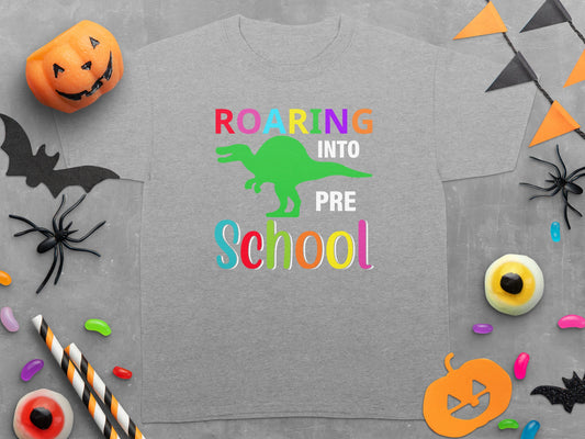 Gray t-shirt with "Roaring Into Pre School" and green dinosaur graphic.