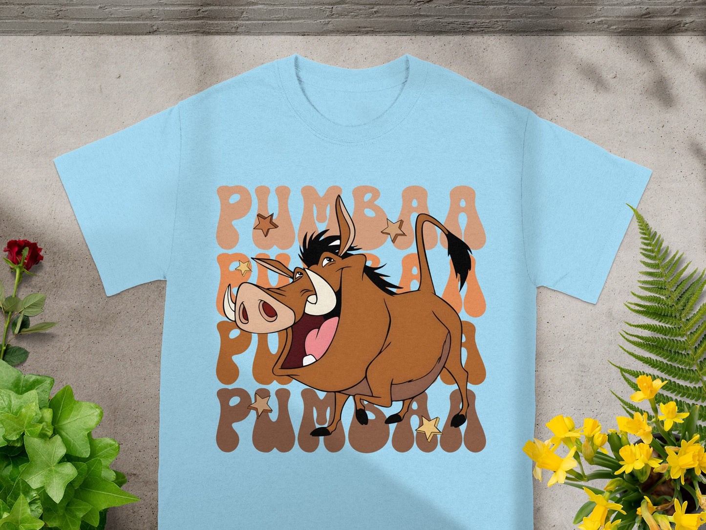 Light blue t-shirt with Pumbaa from The Lion King graphic.