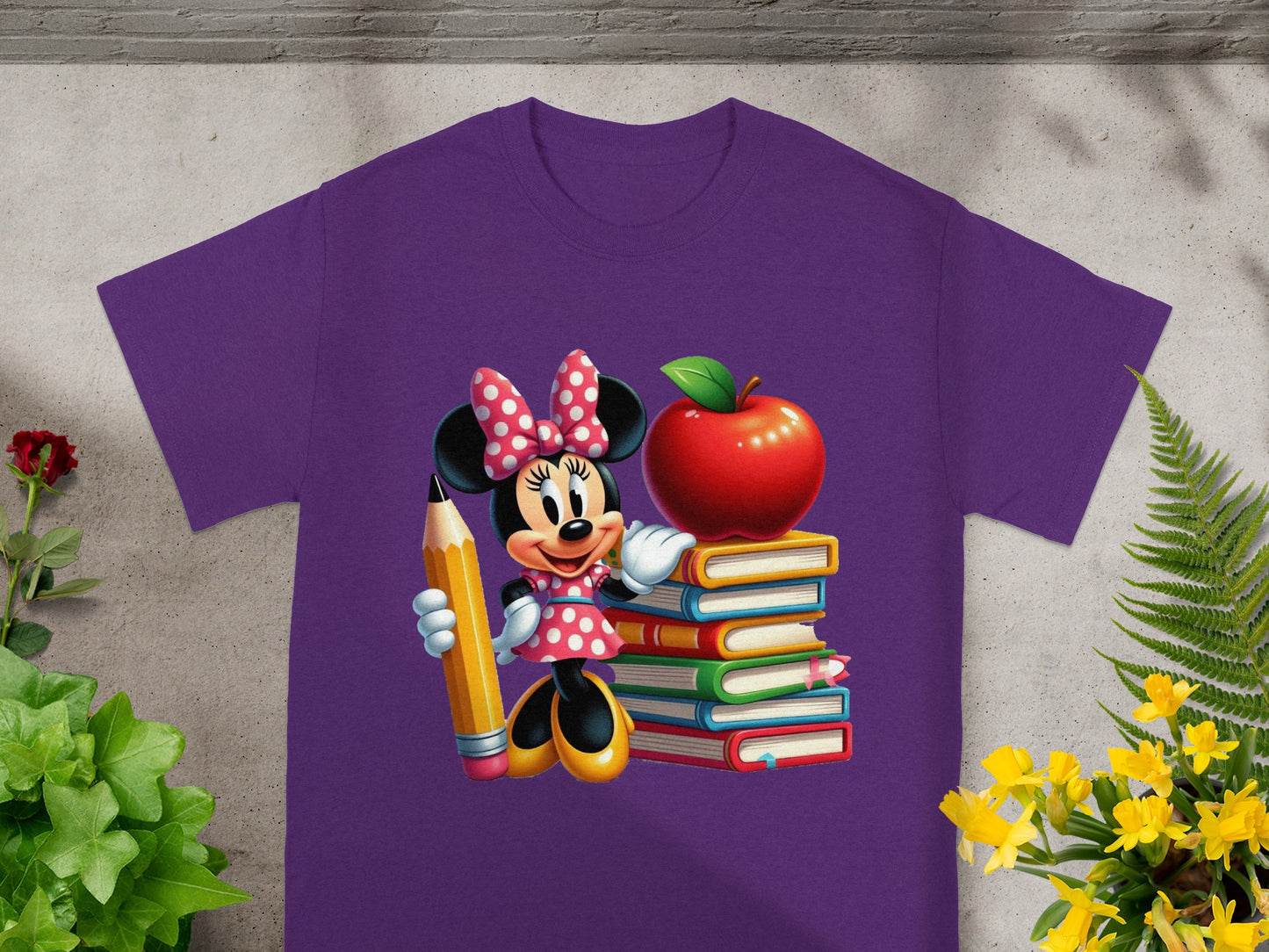 Minnie Mouse with pencil and stack of books with red apple.