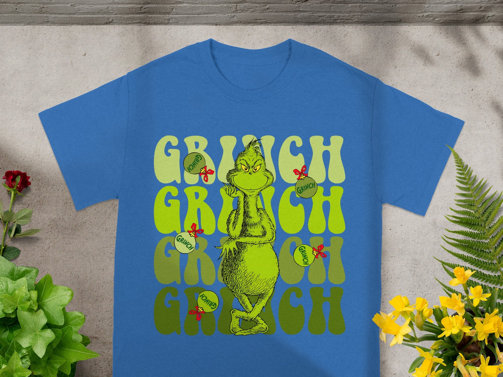 Blue t-shirt with The Grinch character and "Grinch" text.