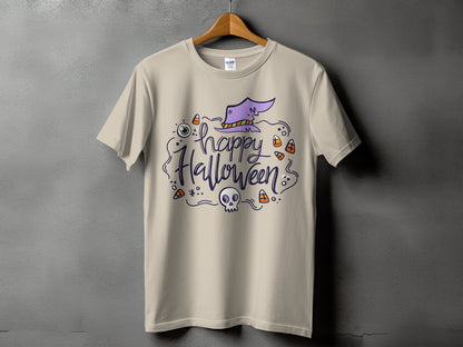 Light beige t-shirt with "Happy Halloween" text, a witch's hat, eye, skull, and candy corn.