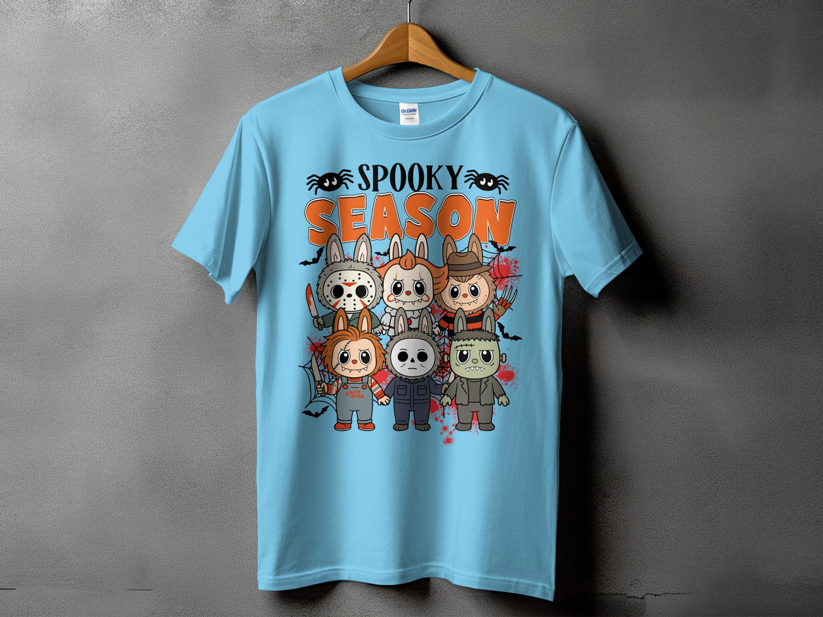 Light blue t-shirt with "Spooky Season" text and cartoon horror characters.