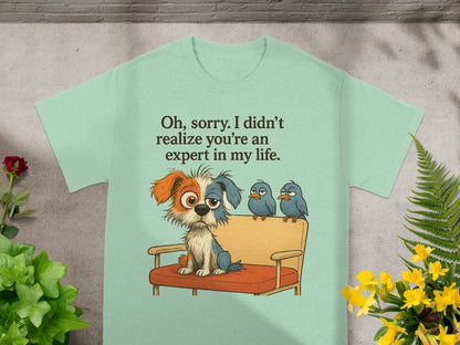 Light green t-shirt with a cartoon dog and three birds on a couch, text reads "Oh, sorry. I didn't realize you're an expert in my life."