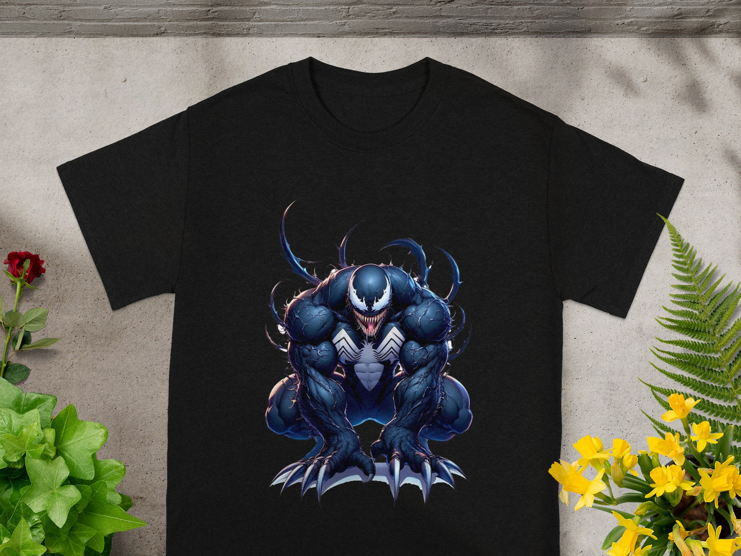 Black t-shirt with a dark, muscular Venom illustration.