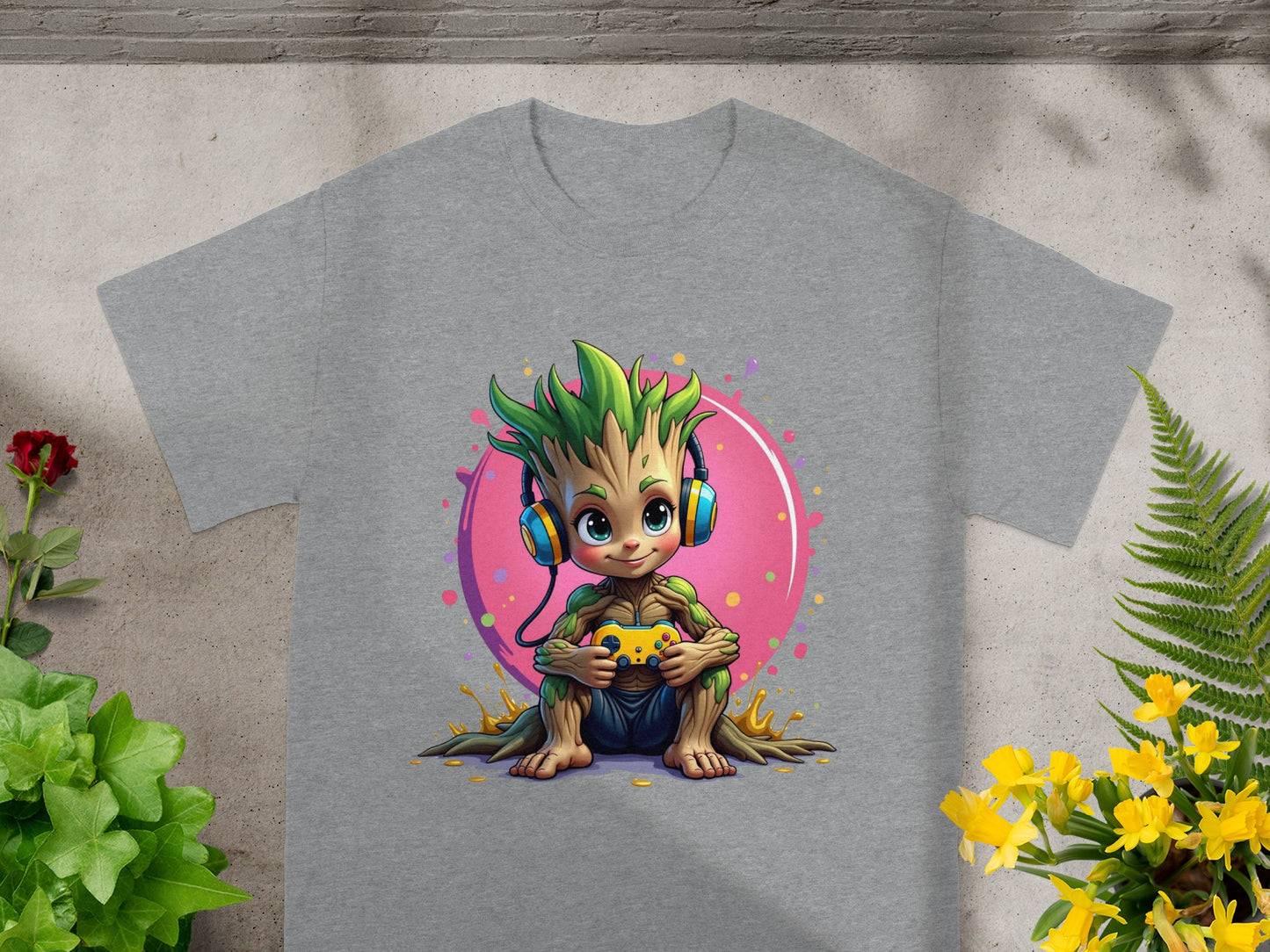 Baby Groot wearing headphones holds a video game controller.