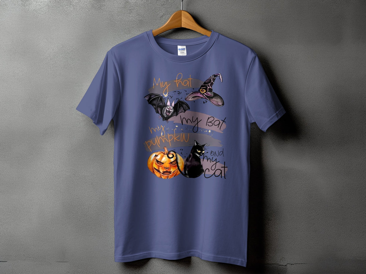 Purple t-shirt with Halloween graphic: witch hat, bat, pumpkin, and cat.