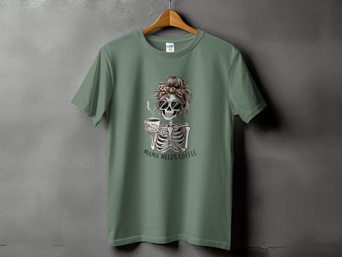 Green t-shirt with skeleton graphic holding coffee and text "MAMA NEEDS COFFEE".