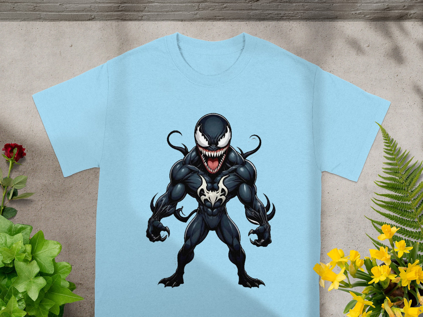 Light blue t-shirt featuring a cartoon illustration of Venom in a dynamic pose.
