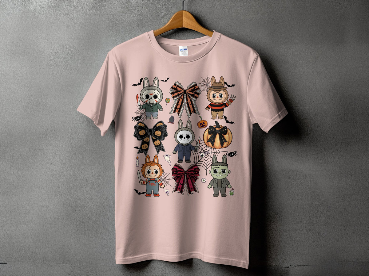 Pink t-shirt with Halloween horror characters and bows graphic print.