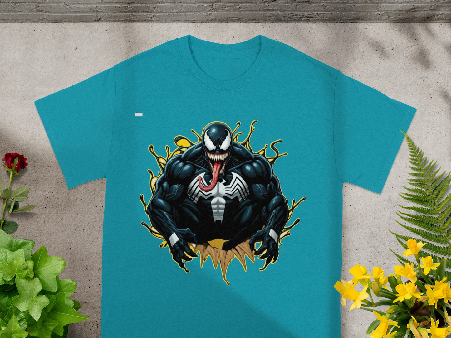 Teal t-shirt with Venom artwork and yellow splatters.