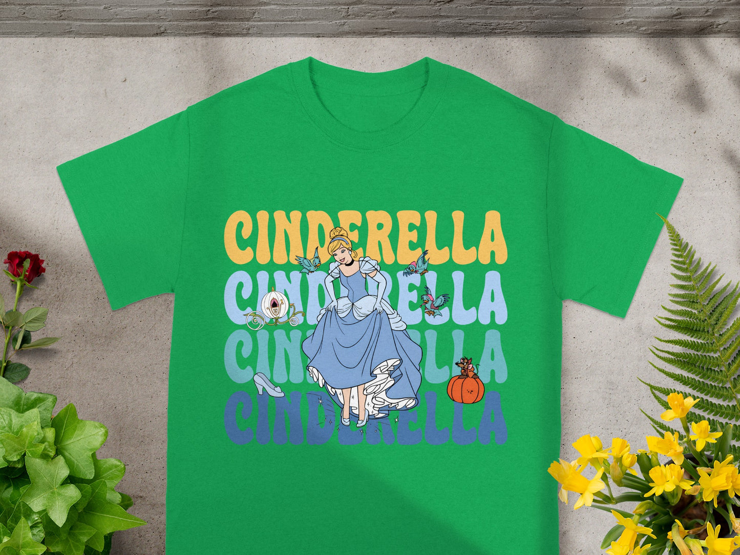 Green t-shirt with Cinderella graphic and text.