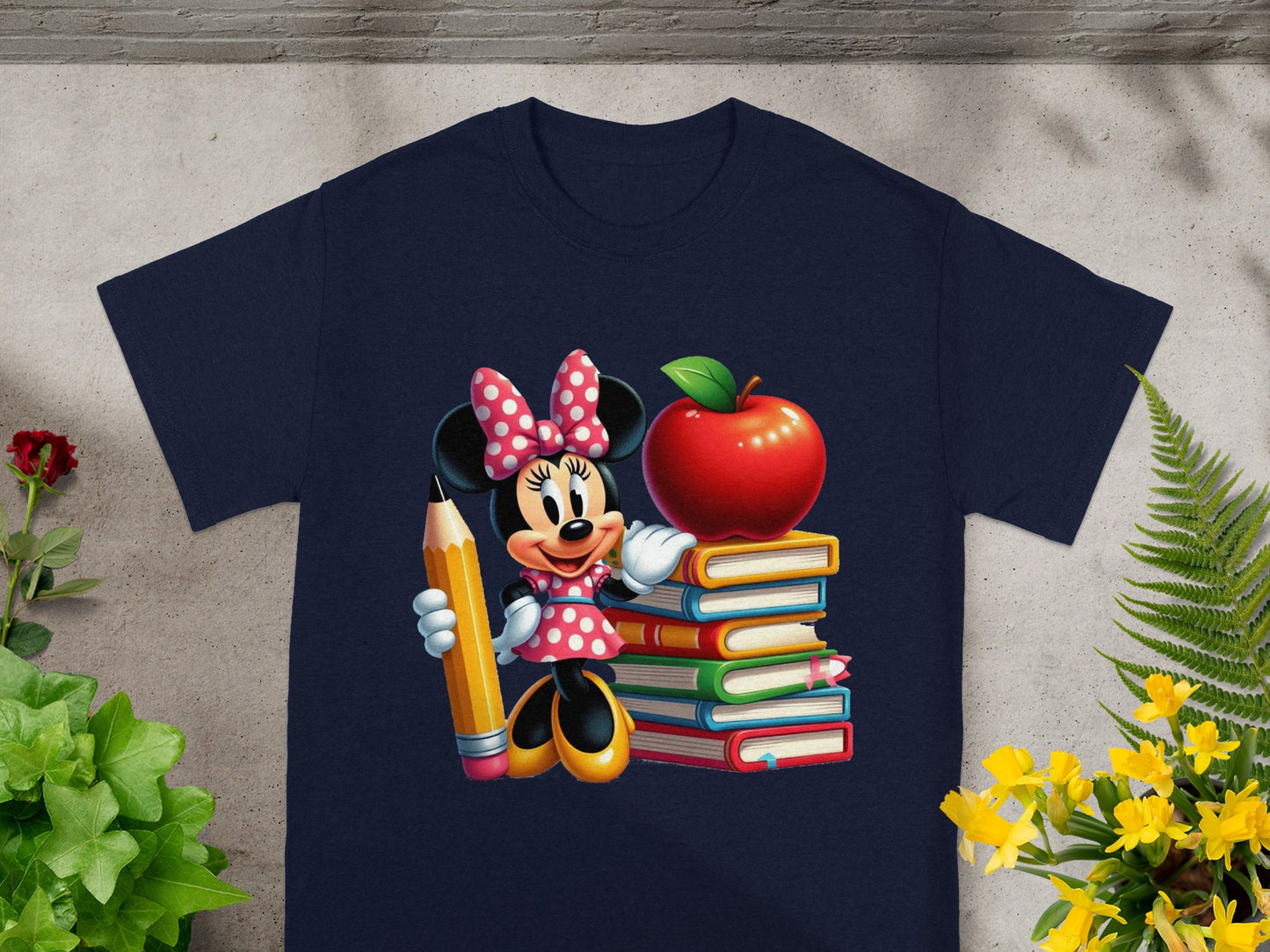 Minnie Mouse holding a pencil beside a stack of colorful books and an apple.