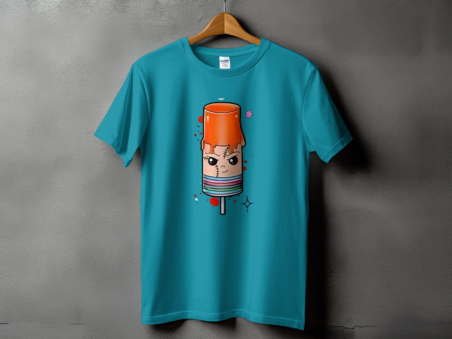Teal t-shirt with a cartoon popsicle graphic featuring a face and dripping orange top.