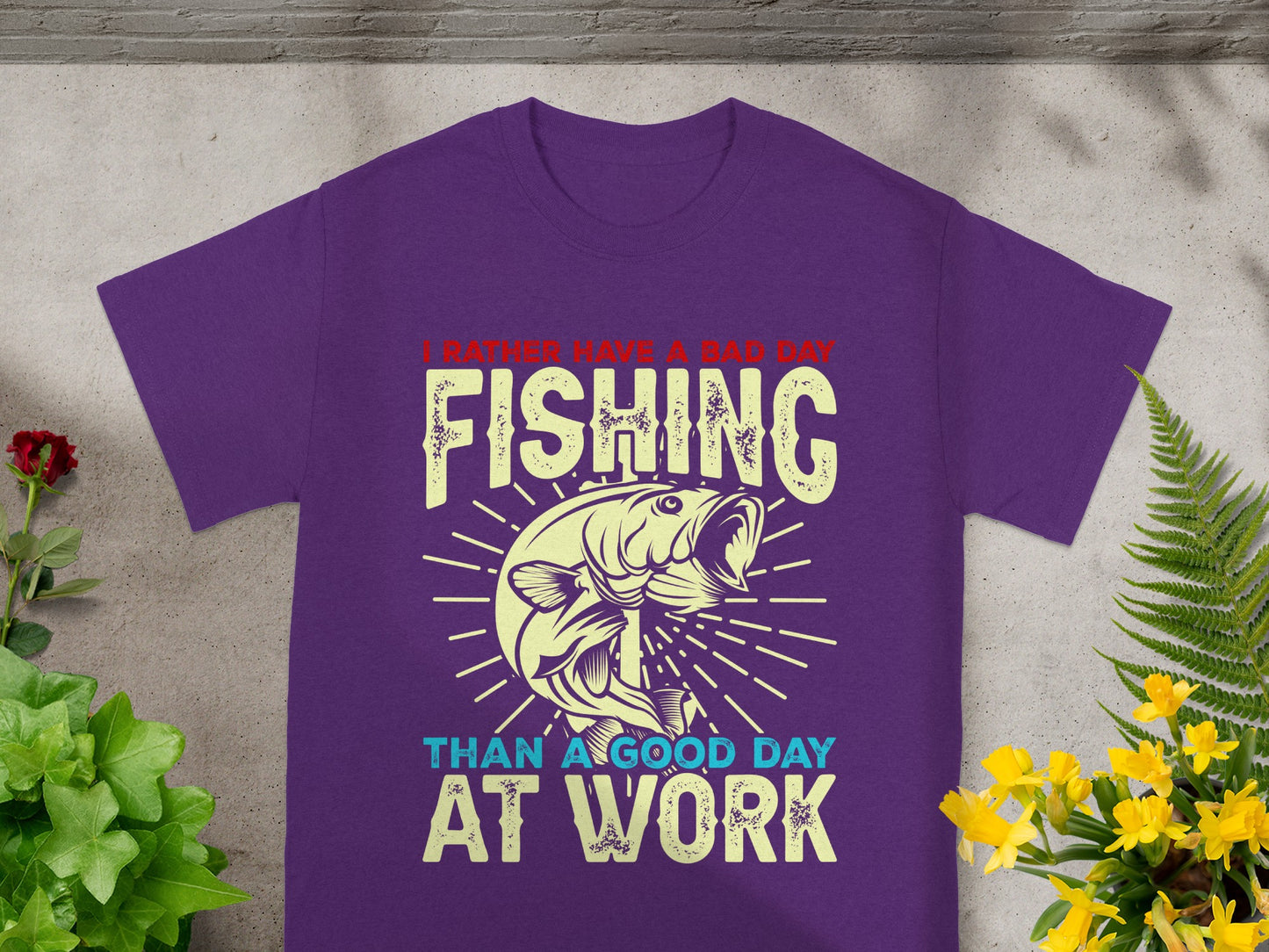 Purple t-shirt with text "I rather have a bad day fishing than a good day at work".