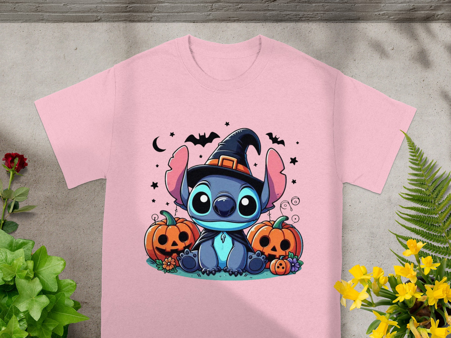 Pink t-shirt with Stitch in a witch hat and pumpkins.