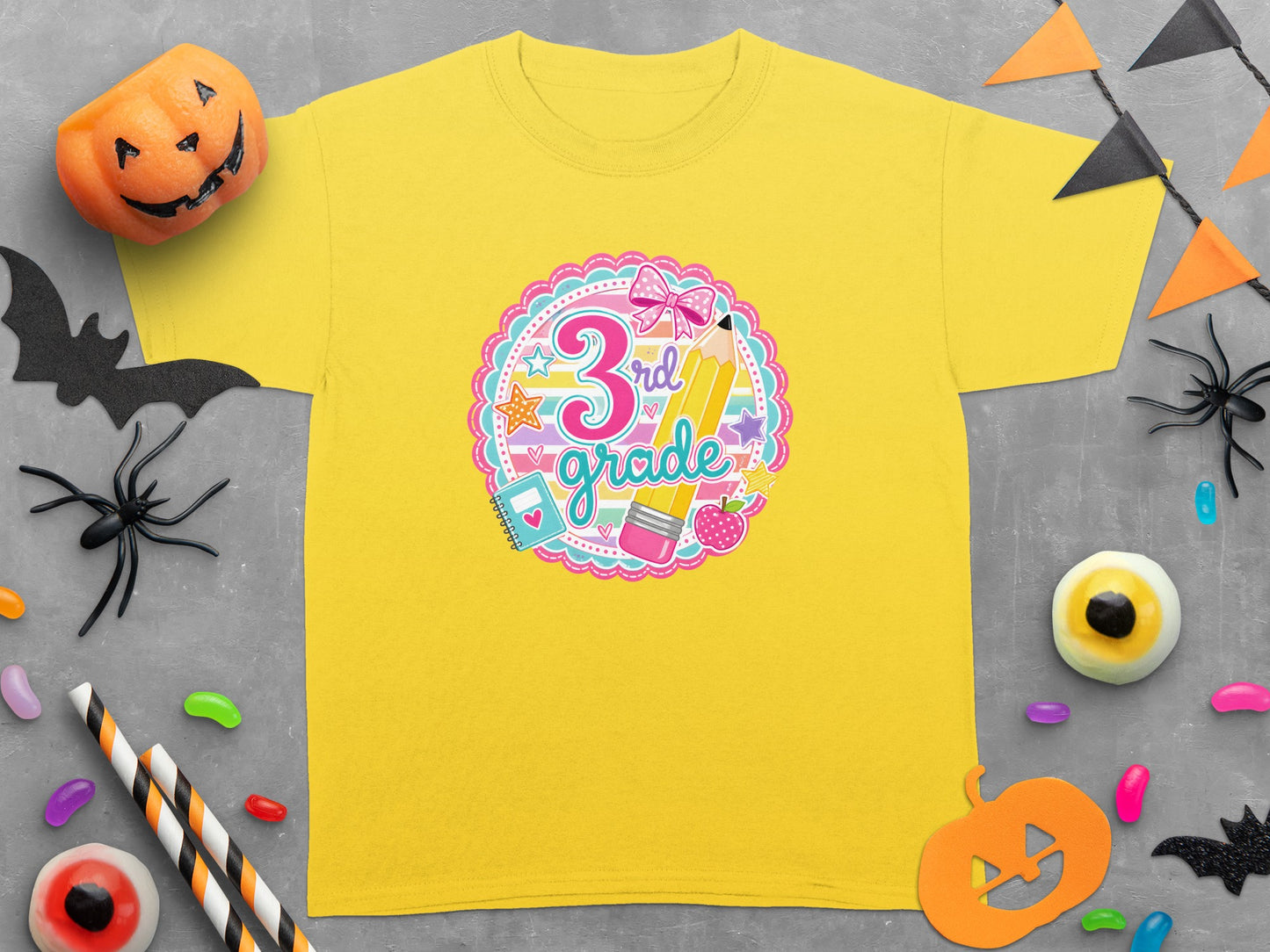 Yellow 3rd grade graphic t-shirt with pencil, apple, and bow.