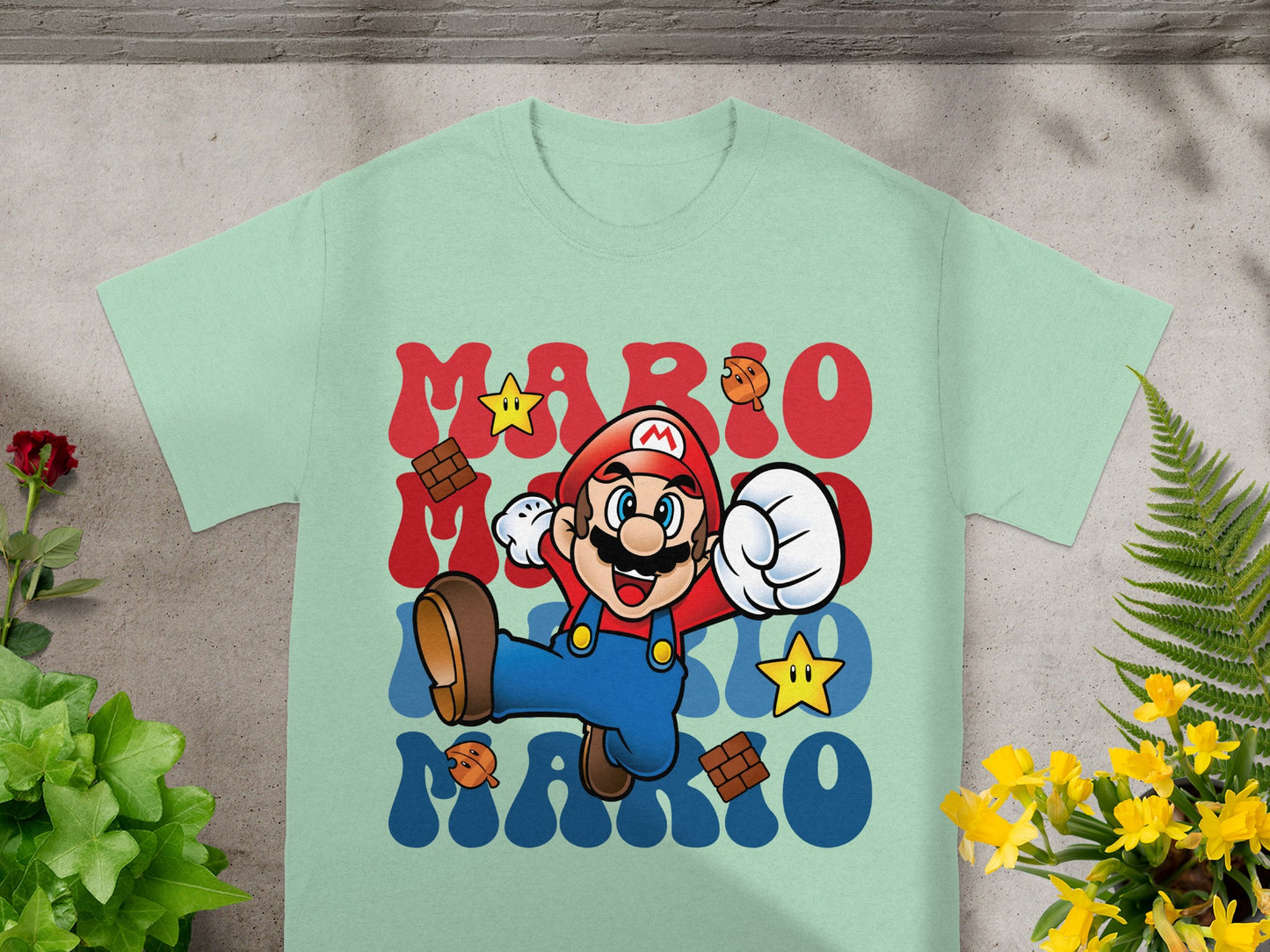 Mint t-shirt with Mario jumping and "MARIO" in red and blue text.