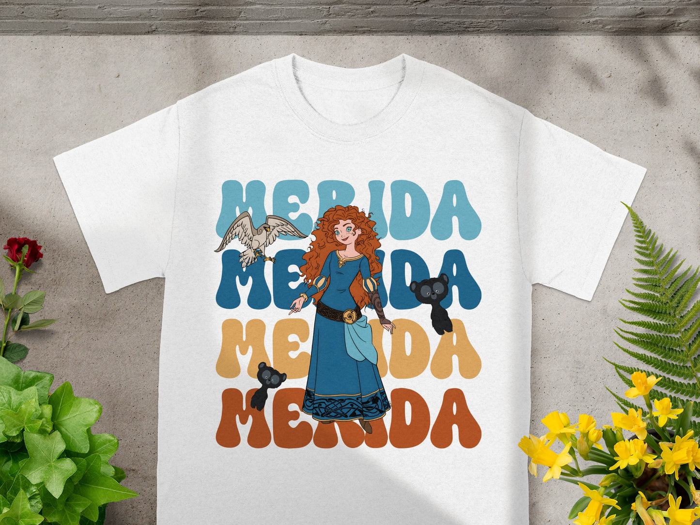 Merida with a bird and a bear on a white t-shirt.