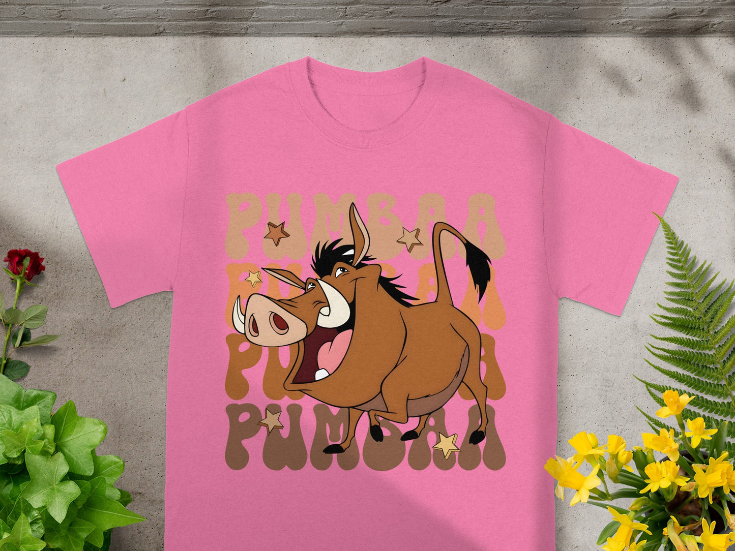 Pink t-shirt with Pumbaa from The Lion King graphic.