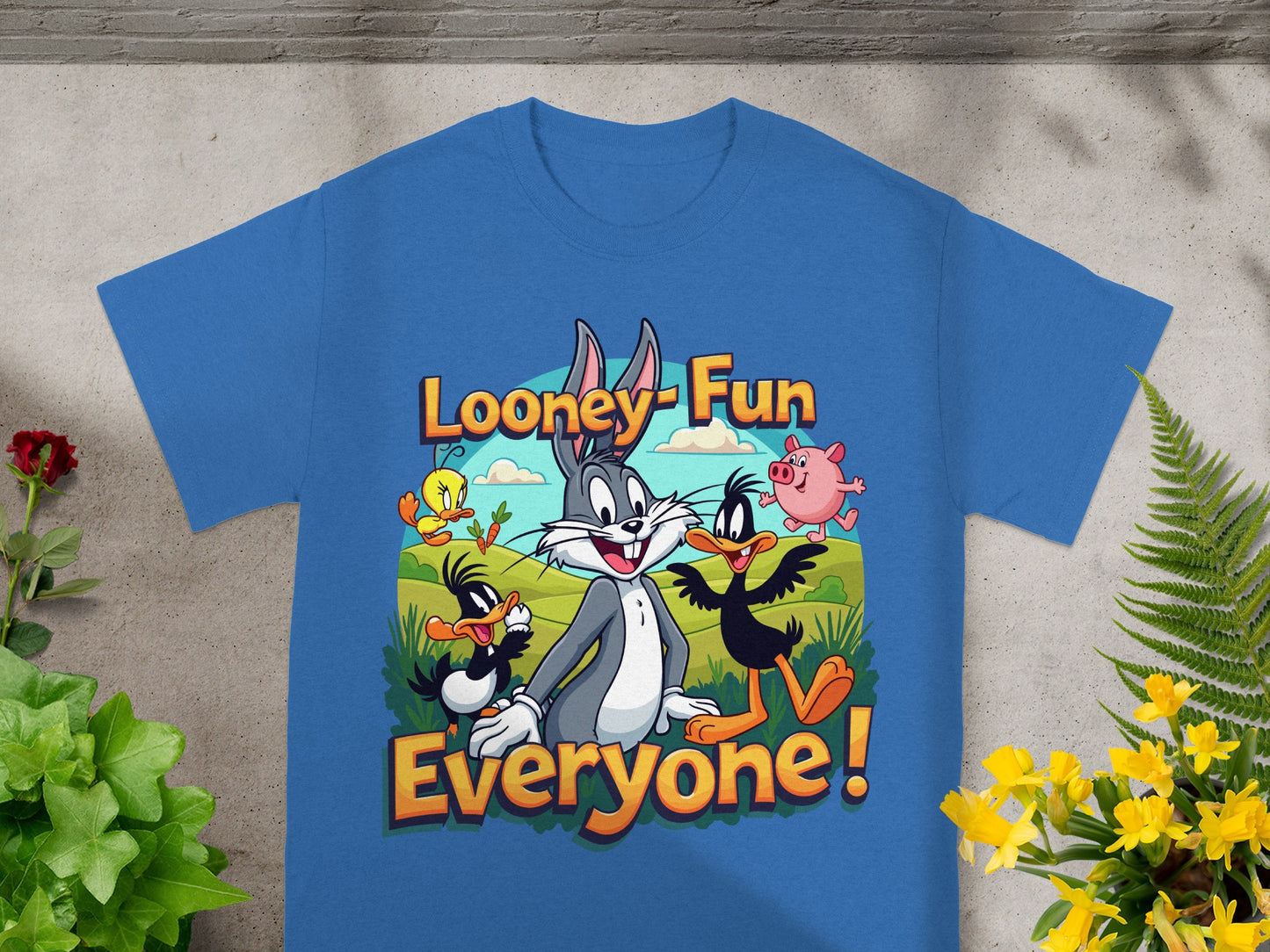 Blue t-shirt with Looney Tunes characters Bugs Bunny, Daffy Duck, and Porky Pig.