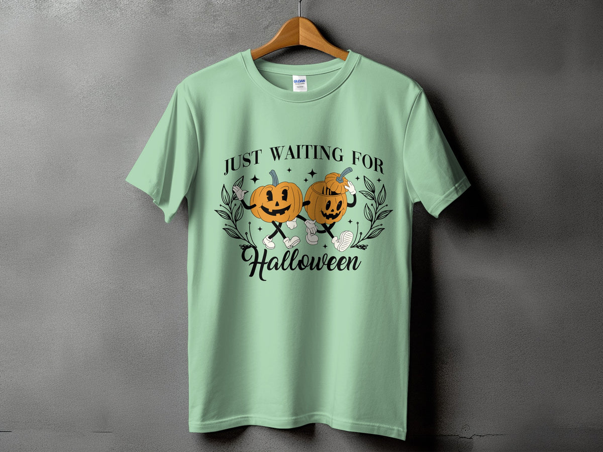 Light green t-shirt with vintage pumpkins and "Just Waiting For Halloween" text.