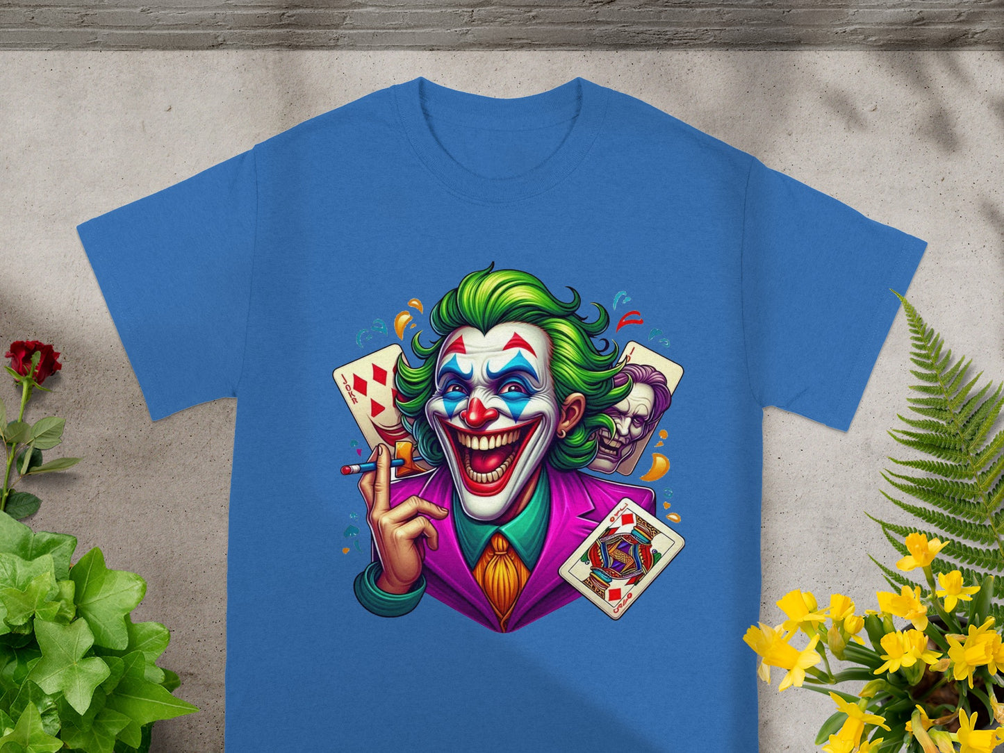 Blue t-shirt with Joker illustration holding playing cards.