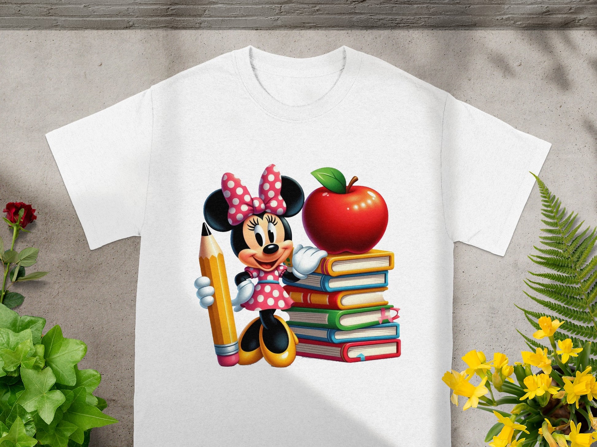 Minnie Mouse holding a pencil next to a stack of colorful books and an apple.
