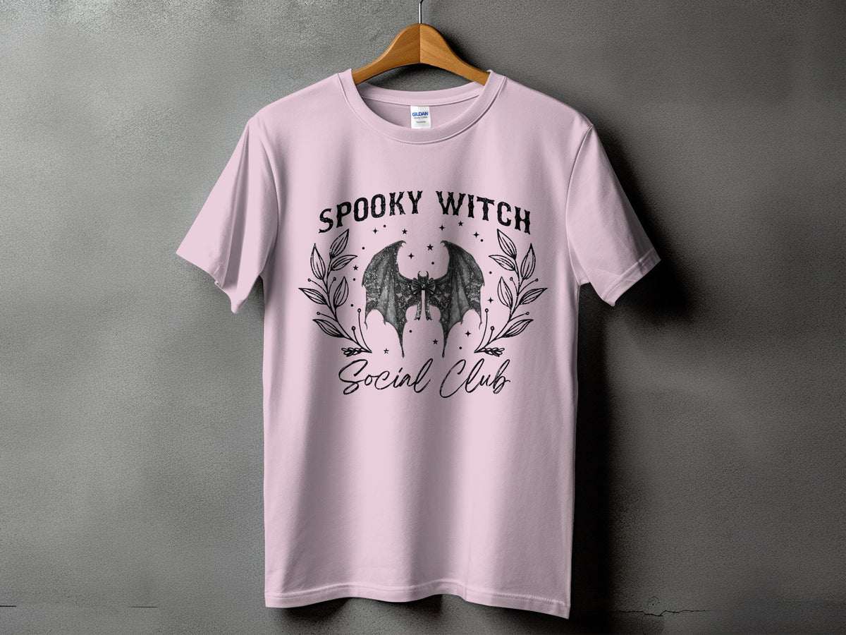 Pink t-shirt with "Spooky Witch Social Club" text and a bat graphic.