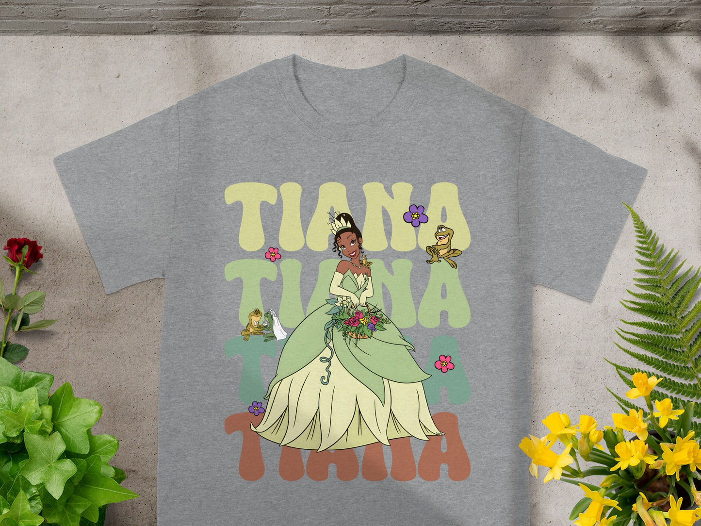 Tiana in a green gown with Naveen and Ray from The Princess and the Frog.
