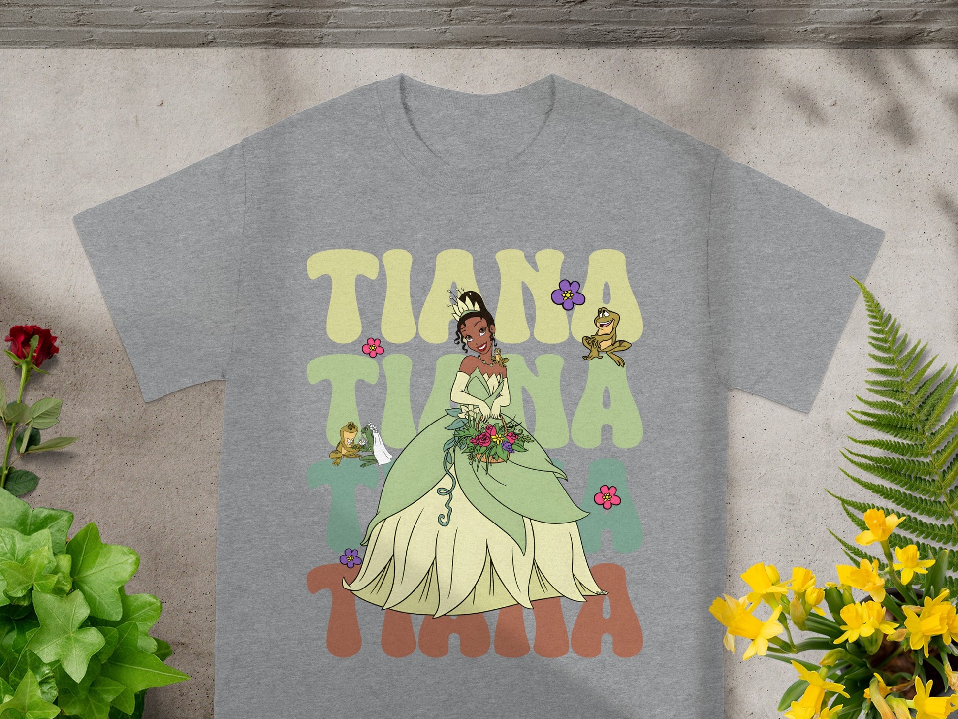 Tiana in a green gown with Naveen and Ray from The Princess and the Frog.