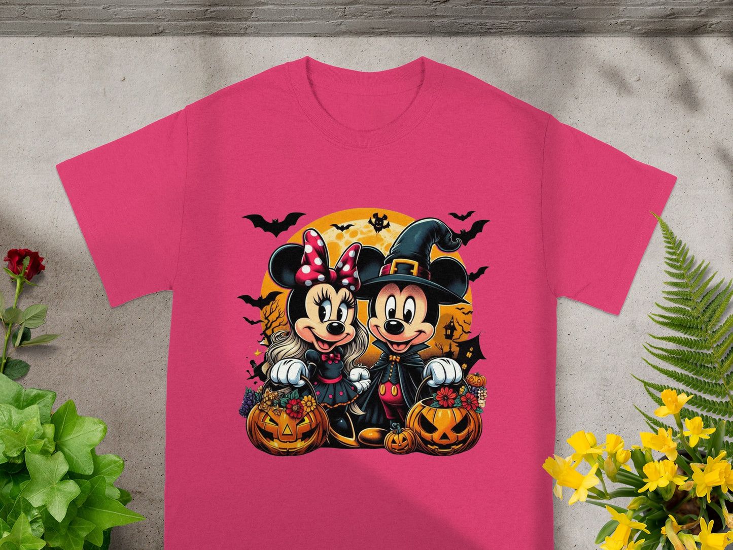 Minnie and Mickey Mouse in Halloween costumes with pumpkins and bats.