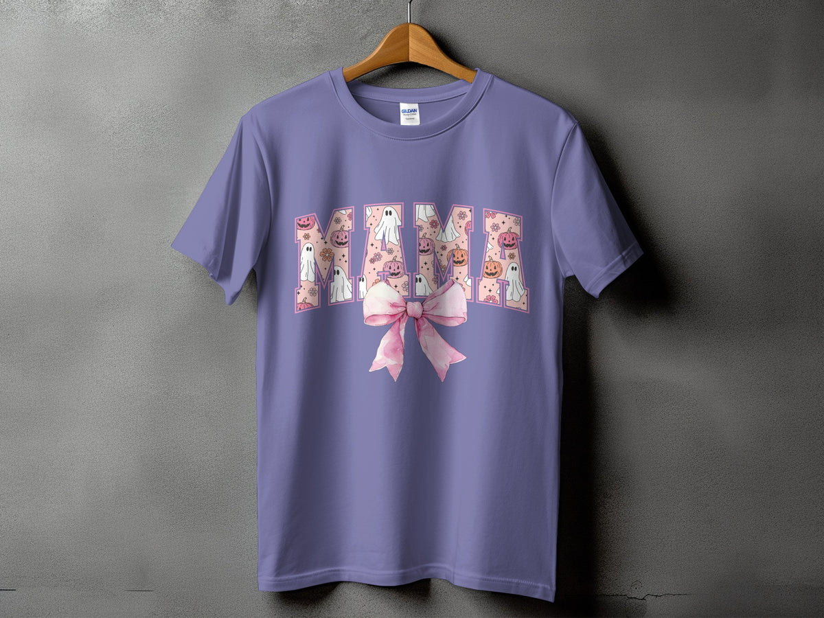 Purple t-shirt with "Mama" text filled with pumpkins and ghosts, and a pink bow.