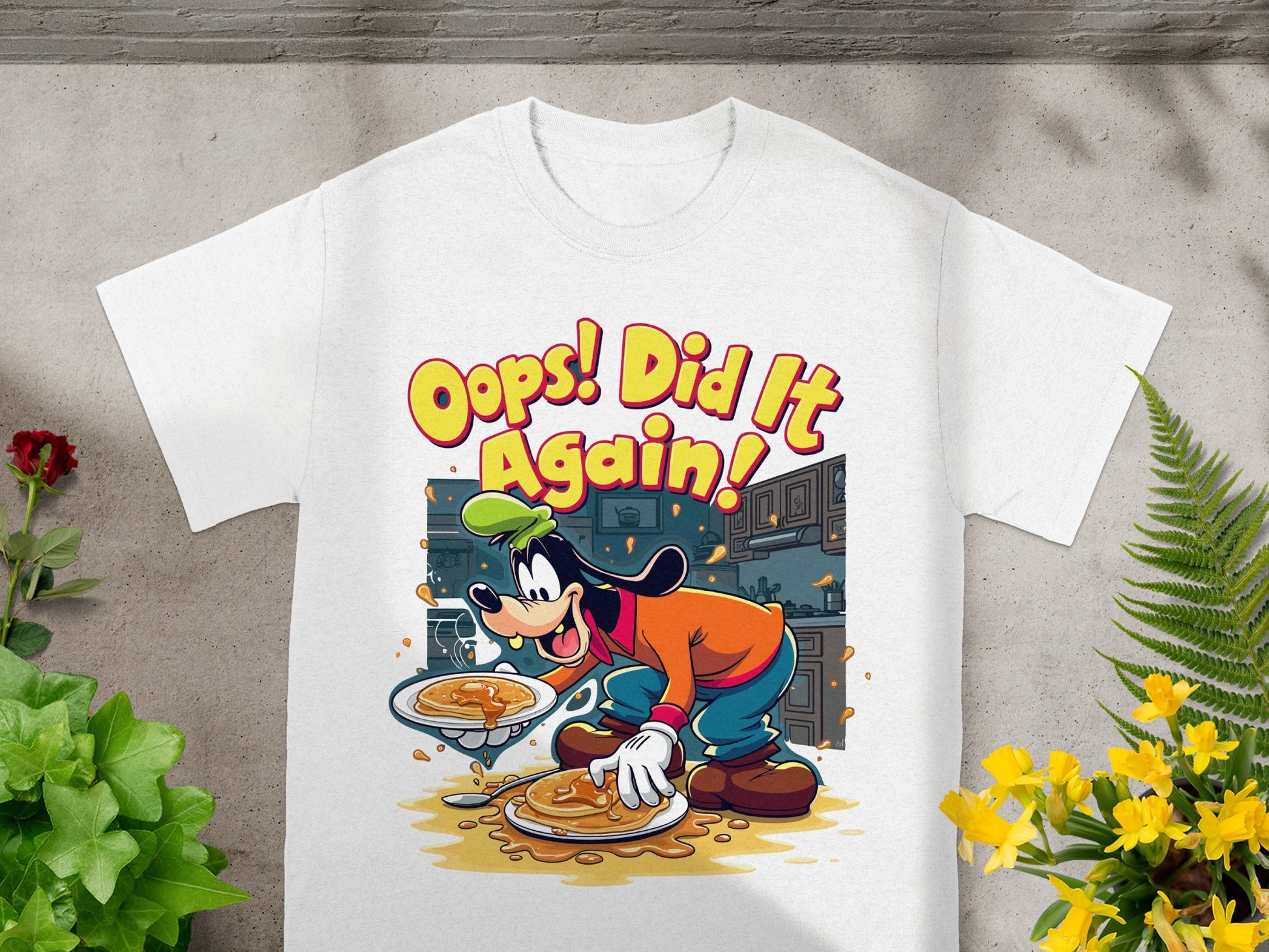 Goofy in cartoon style wearing a chef hat and apron, serving pancakes with text "Oops! Did It Again!"