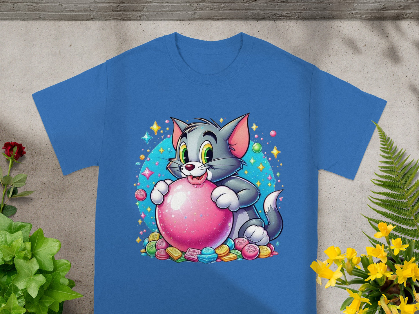 Blue t-shirt with Tom cat holding a pink bubblegum ball.