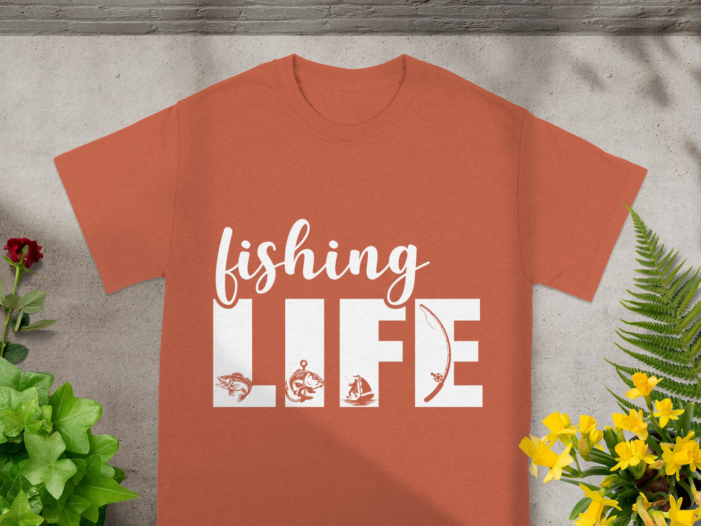 Orange t-shirt with white text and graphics that read "FISHING LIFE."