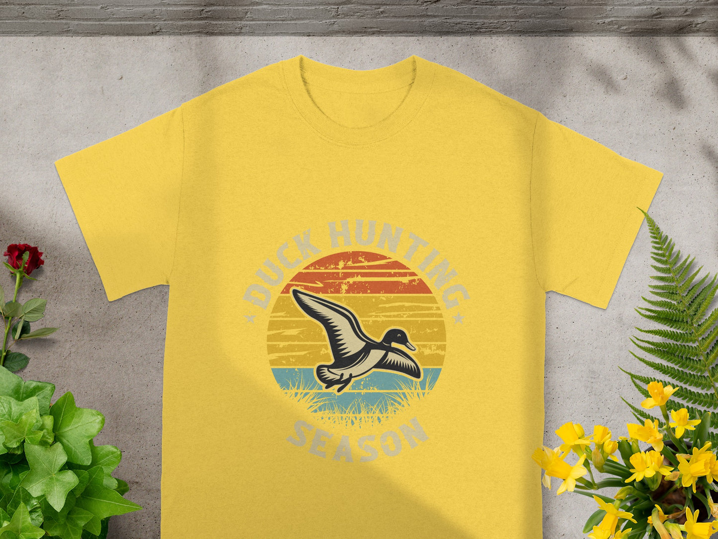 Yellow t-shirt with "DUCK HUNTING SEASON" text and a duck graphic.