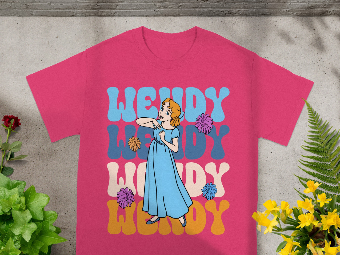 Pink t-shirt with "Wendy" in colorful bubble letters and cartoon girl.