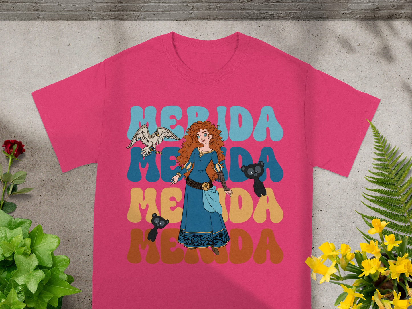 Merida from Brave on a pink t-shirt with "Merida" text in retro font.