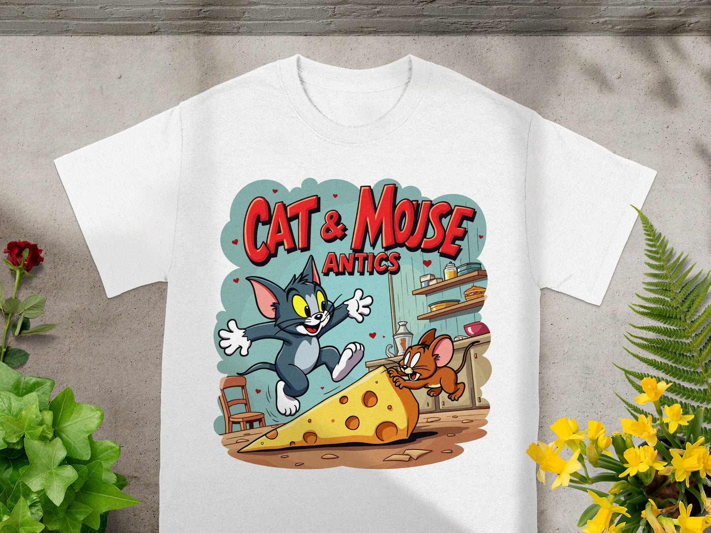 White t-shirt with Tom and Jerry chasing cheese, "Cat & Mouse Antics" text.