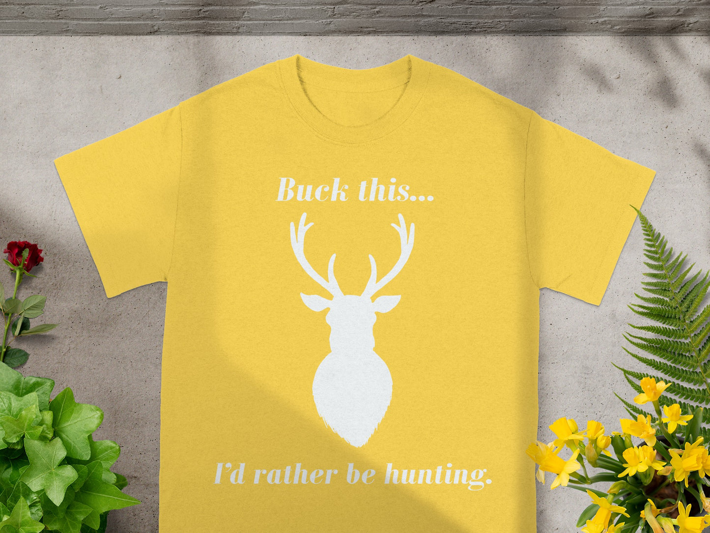 Yellow t-shirt with white deer graphic and text "Buck this... I'd rather be hunting."