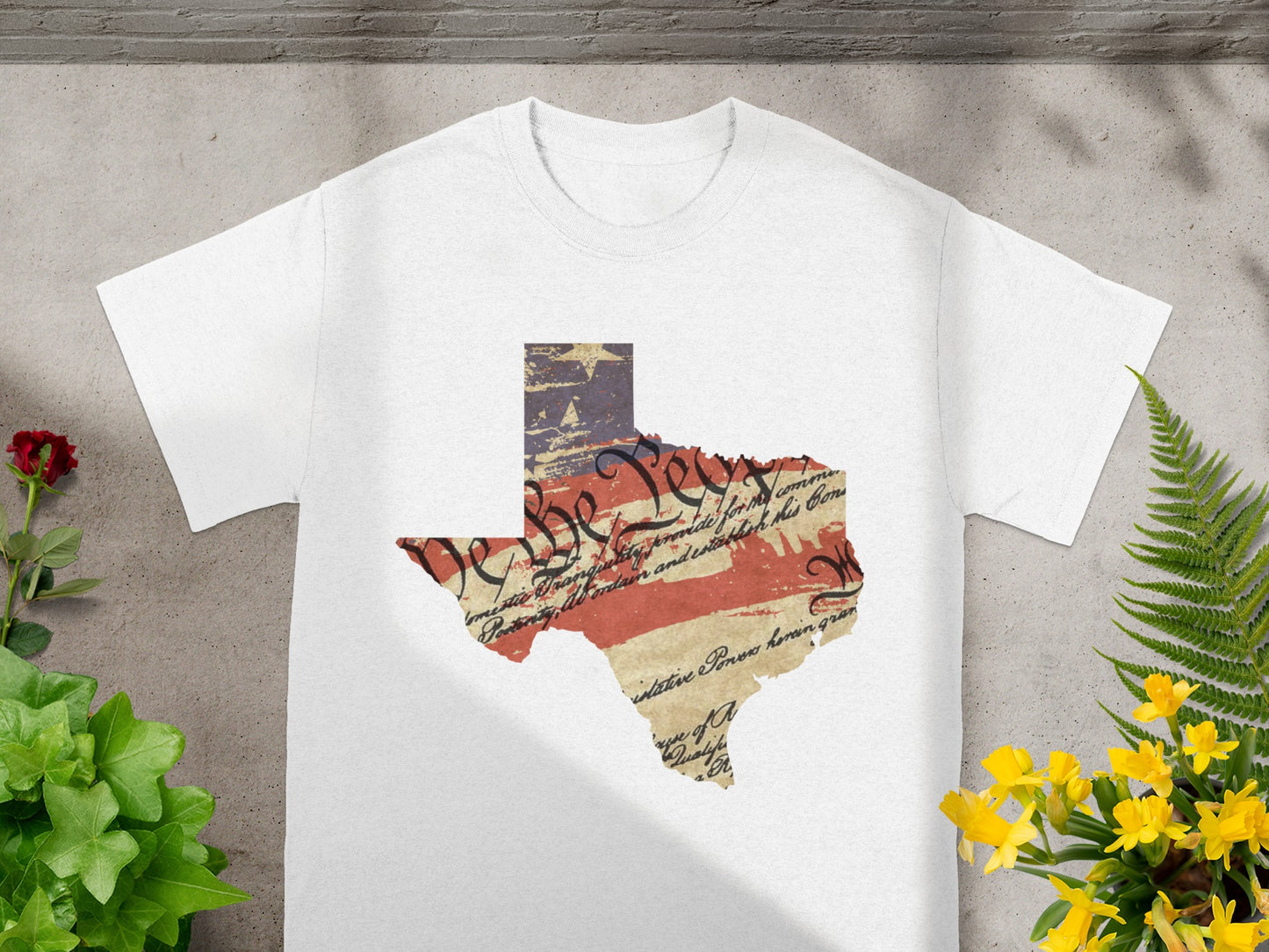White t-shirt with Texas outline in US flag and constitution text.