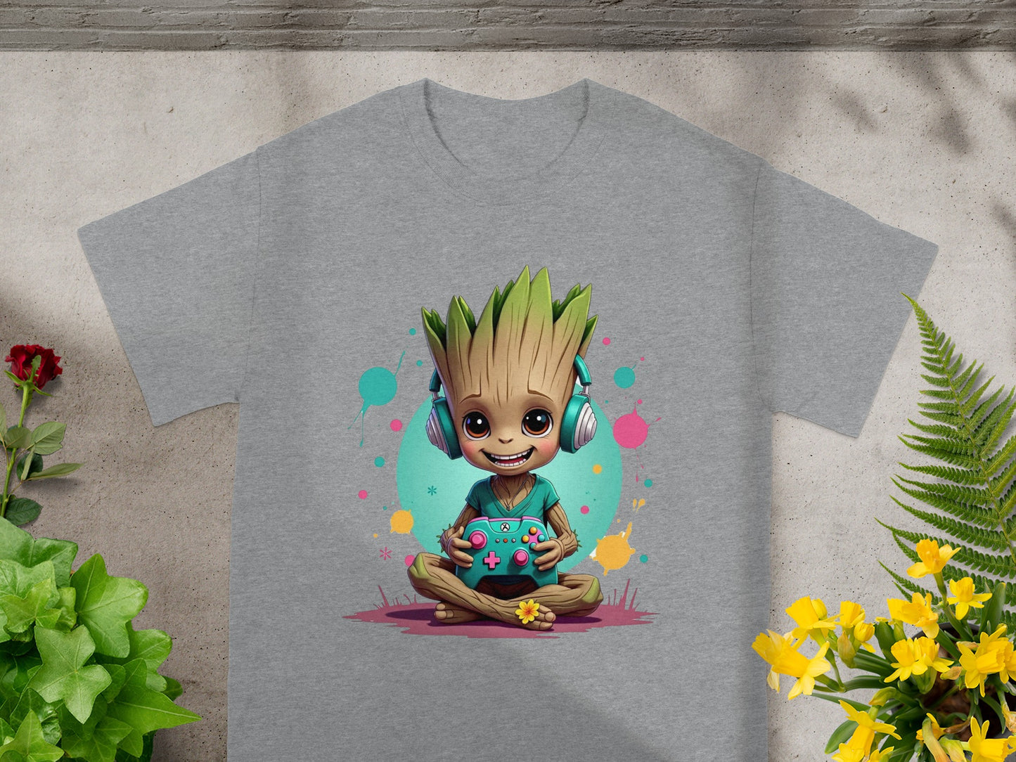 Groot character in headphones sitting cross-legged with a video game controller.