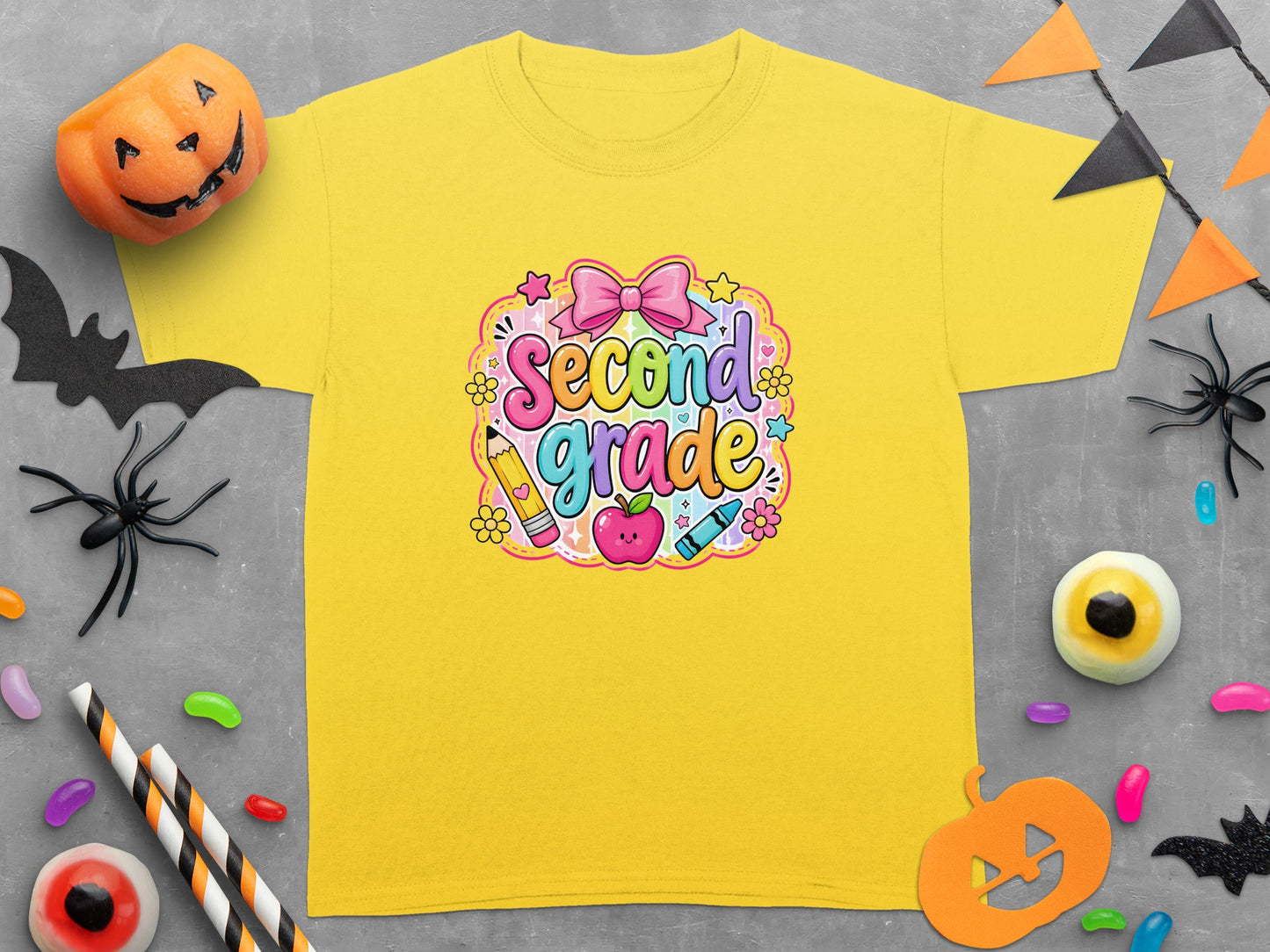 Yellow t-shirt featuring "Second Grade" text with school and Halloween icons.