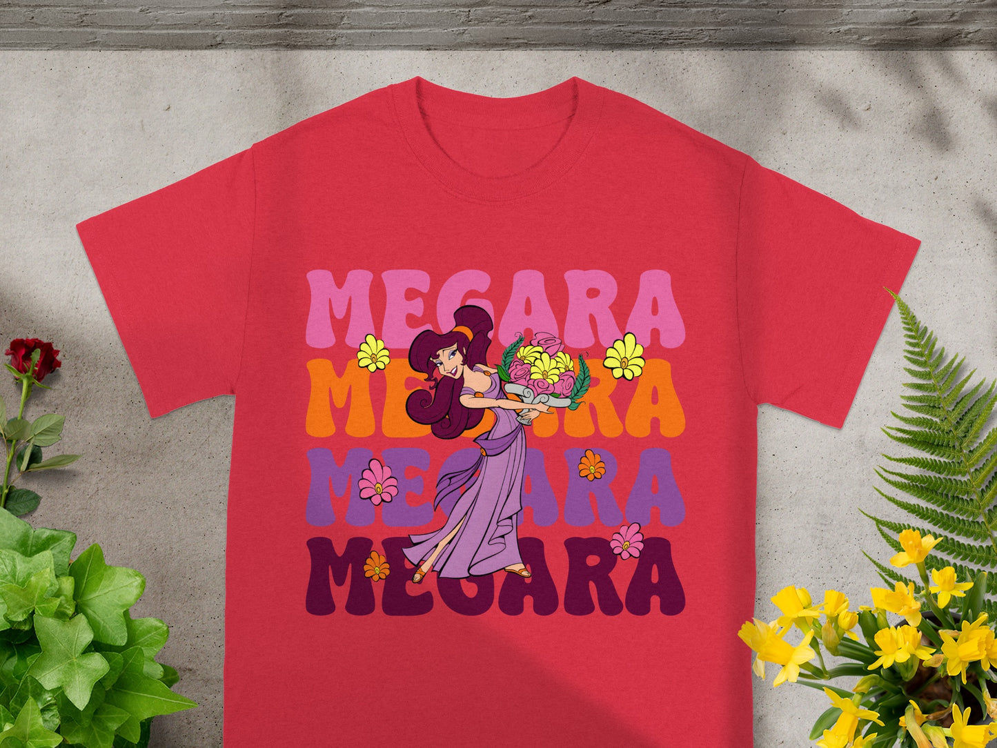 Megara holding flowers on a red t-shirt with colorful "Megara" text.
