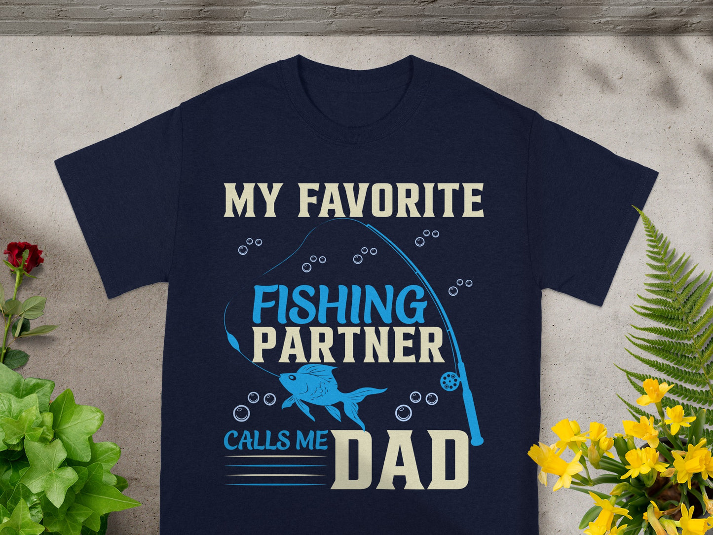 Navy t-shirt with "My Favorite Fishing Partner Calls Me Dad" text and graphic.