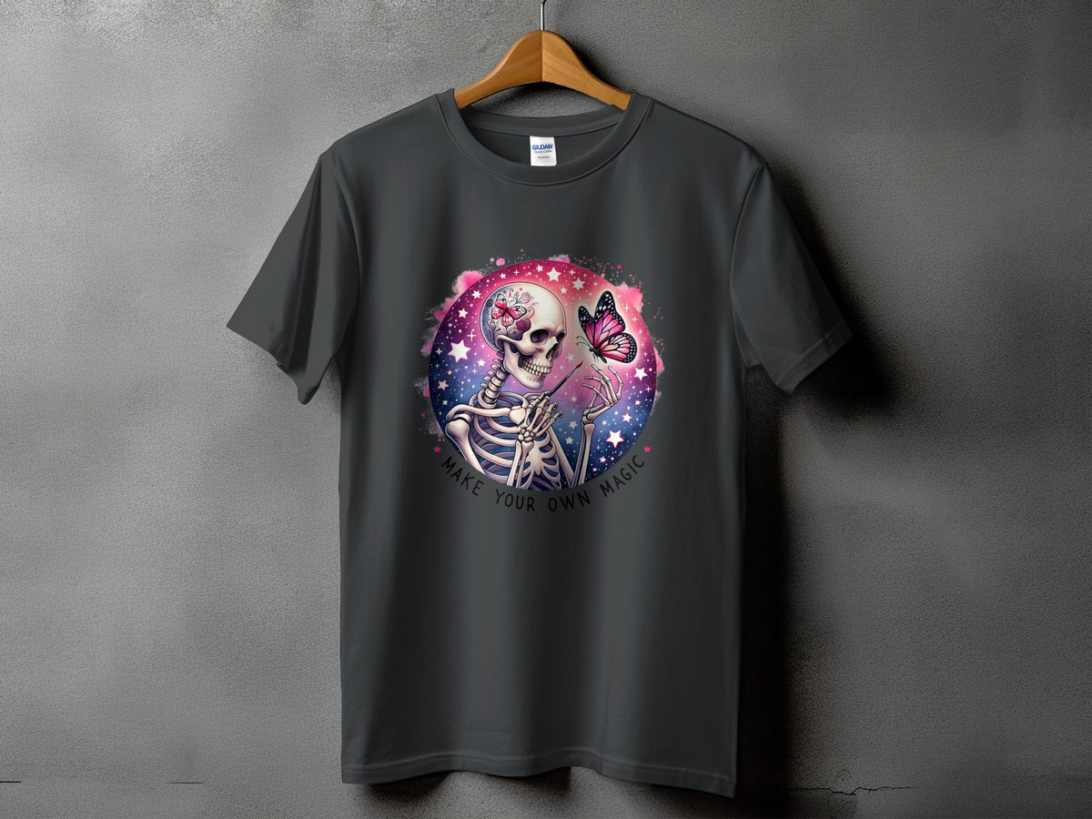 Skeleton holding a paintbrush with a butterfly on a starry, pink background, text "Make Your Own Magic."