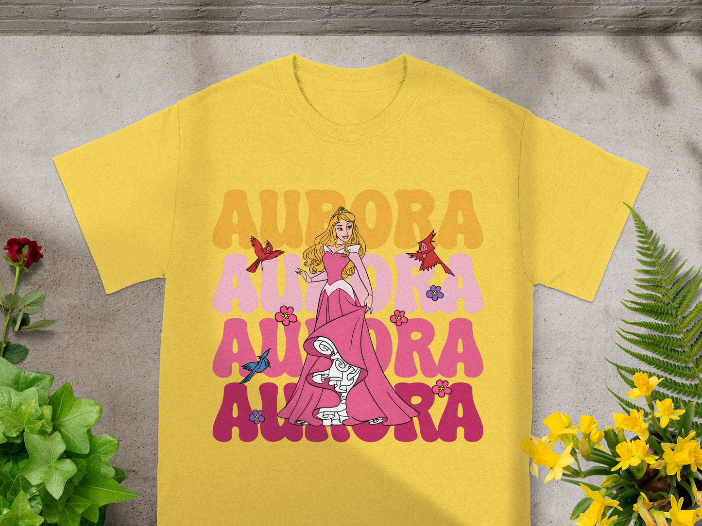 Yellow t-shirt with Princess Aurora graphic and text "Aurora".