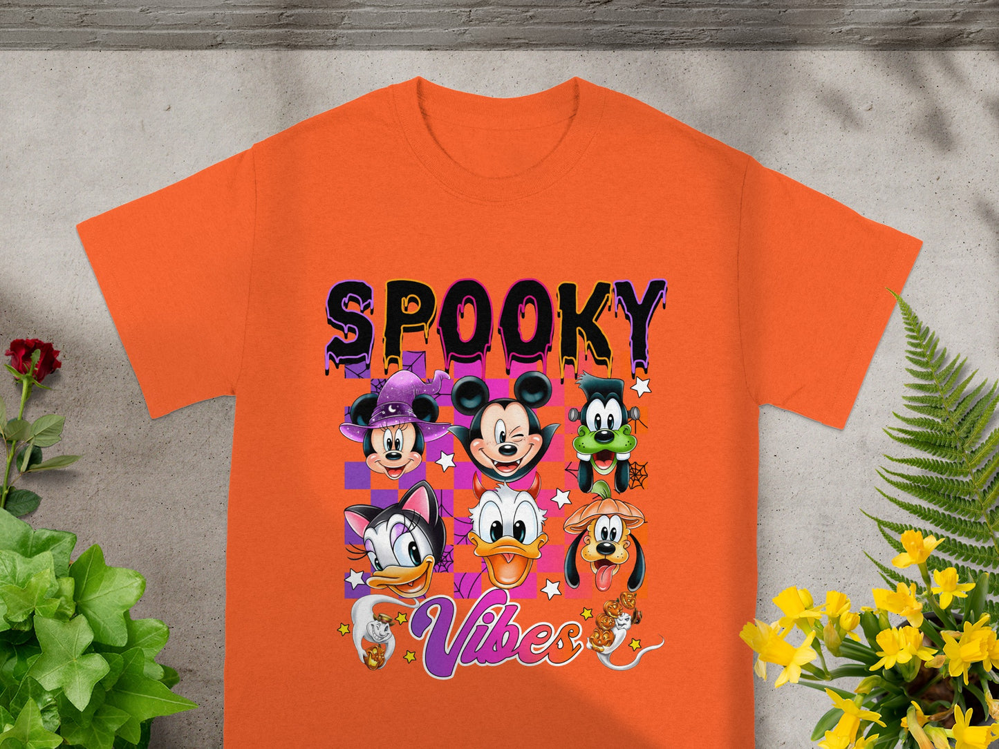 Orange t-shirt with "SPOOKY Vibes" and Halloween Disney characters.