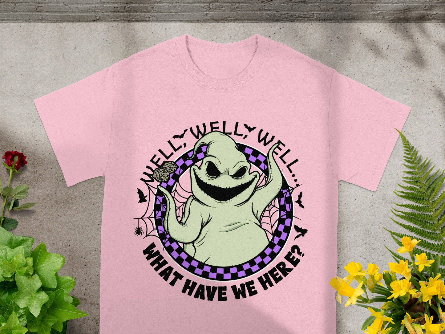 Oogie Boogie from Nightmare Before Christmas on pink t-shirt with text "Well, well, well.. What have we here?"